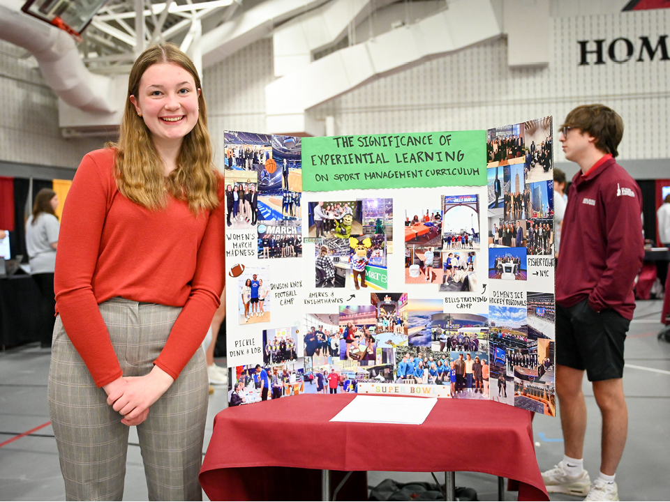 Student sharing research at the Fisher Showcase