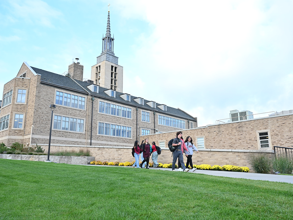 Students walking outside through campus