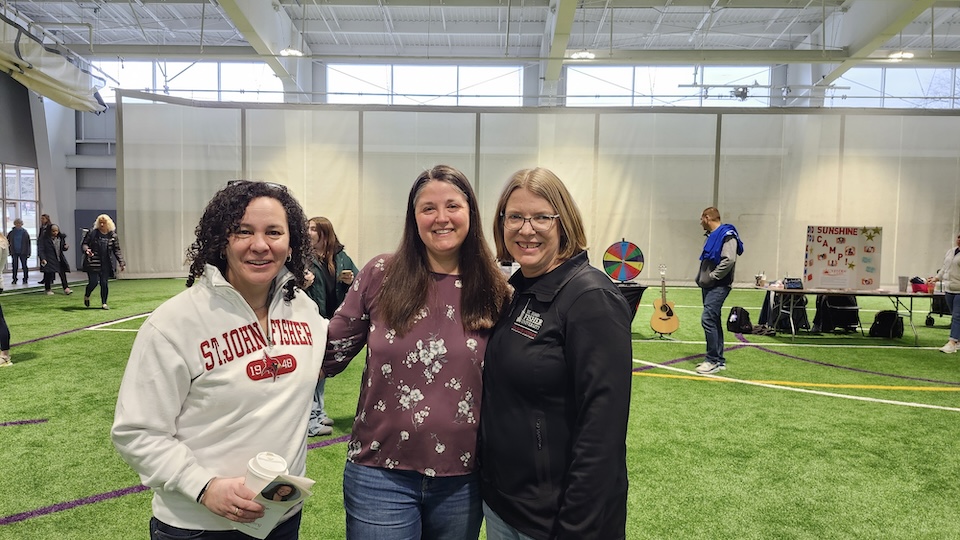 Holly Brown, Onelee Stevens, and Darcie Mersereau standing shoulder to shoulder