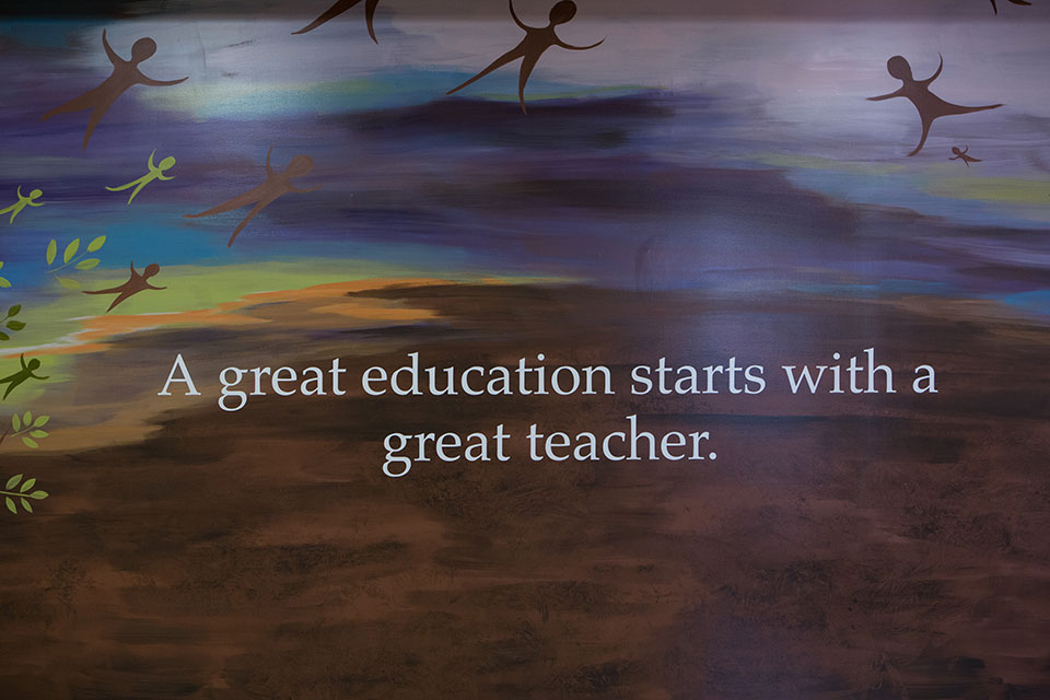 A wall in the Ralph C. Wilson, Jr. School of Education Building reads: A great education starts with a great teacher.