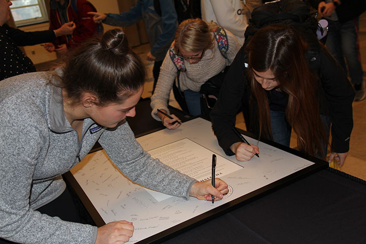 First-year students sign the Fisher Creed.