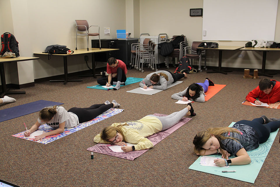 At the beginning of class, students write reflections about their thoughts and emotions.