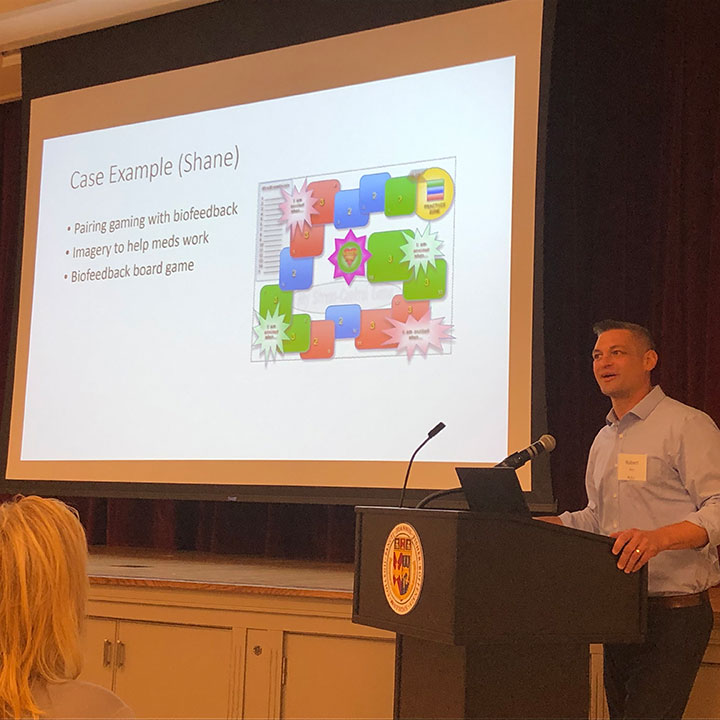 Dr. Rob Rice, associate professor in the Wegmans School of Nursing, talks about biofeedback during the symposium.