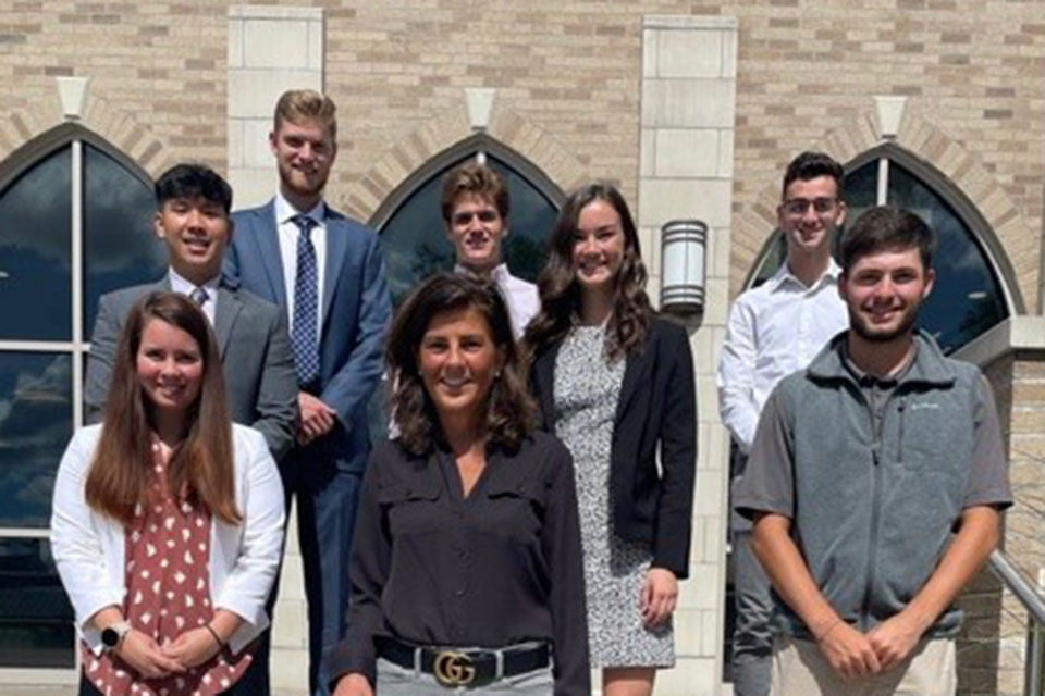 Rebecca Pelino (center) with students from the School of Business.