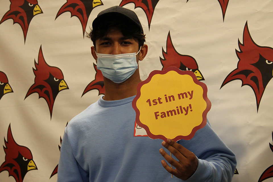 A student holds up a fun sign during the 2021 First Gen Celebration.