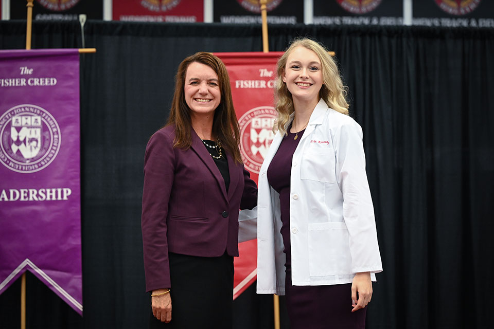 Dean Birnie poses with a first-year pharmacy student.