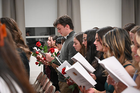 Graduates read the Nightingale Pledge to symbolize their commitment to the profession.