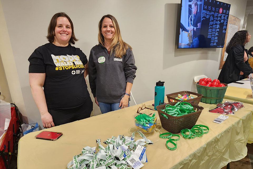 Members of the Health and Wellness Center host a table during Fresh Check Day.