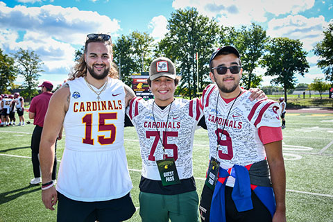 Fisher football player John Lexer with this year's honorary coaches.