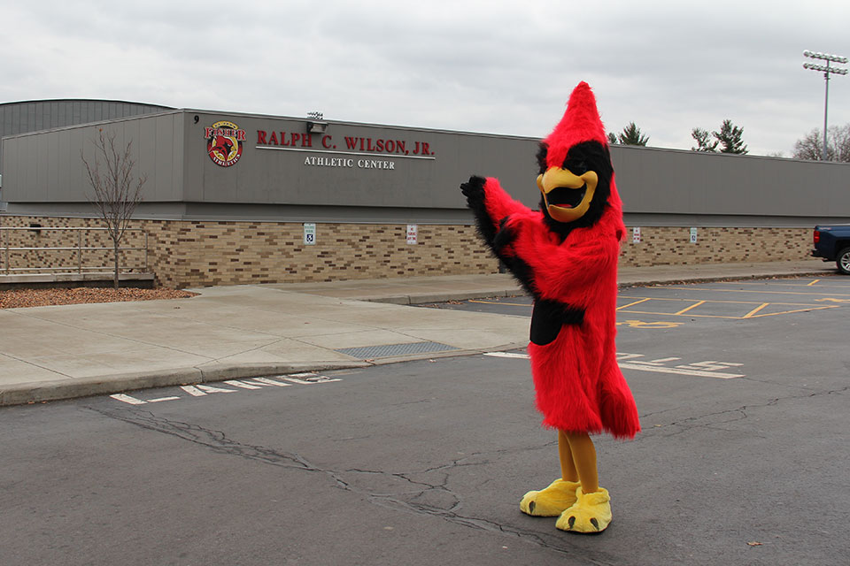 Cardinal greets guests onto campus.