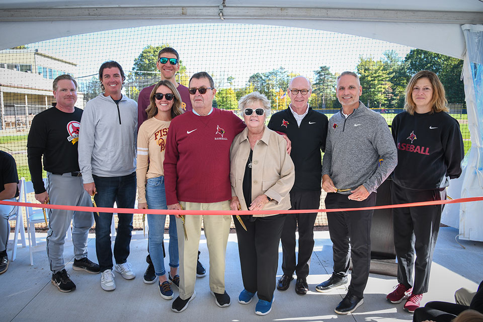 Kevin and Peggy Dugan, President Rooney, and members of the Fisher community celebrate the opening of the Dugan Player Development Center.