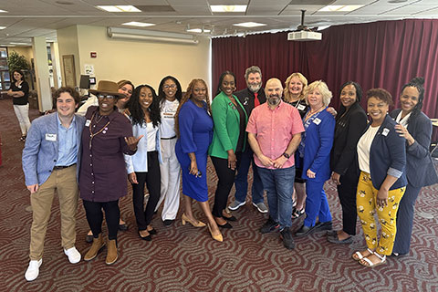 Students in the Ed.D. Program gather for a photo after their poster presentation session.