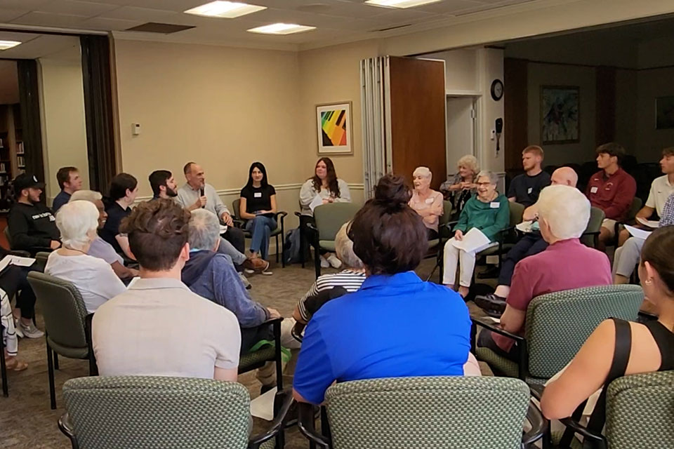 Fisher students and Valley Manor residents talk with documentary filmmaker Steven Loring.