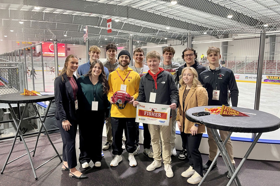 Students in a sport management course that planned an event during the ice hockey games.