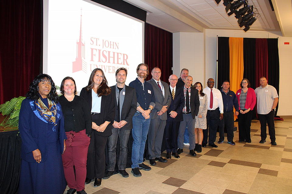 President Rooney with employees celebrating 10 years of service.