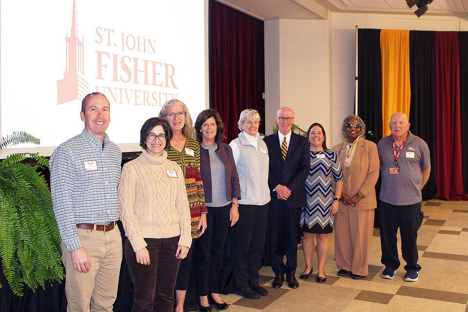 President Rooney with employees celebrating 20 years of service.