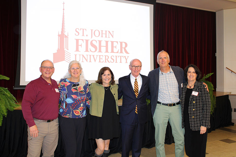 President Rooney with employees celebrating 25 years of service.