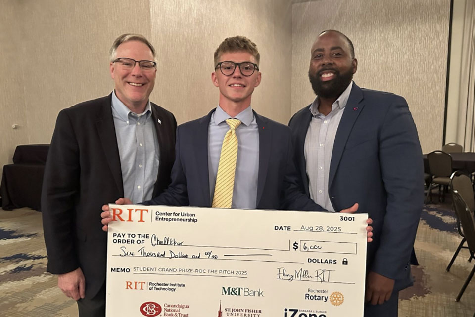 Brennan Conn with Dean Dan Connolly and Dr. Chantz Miles.