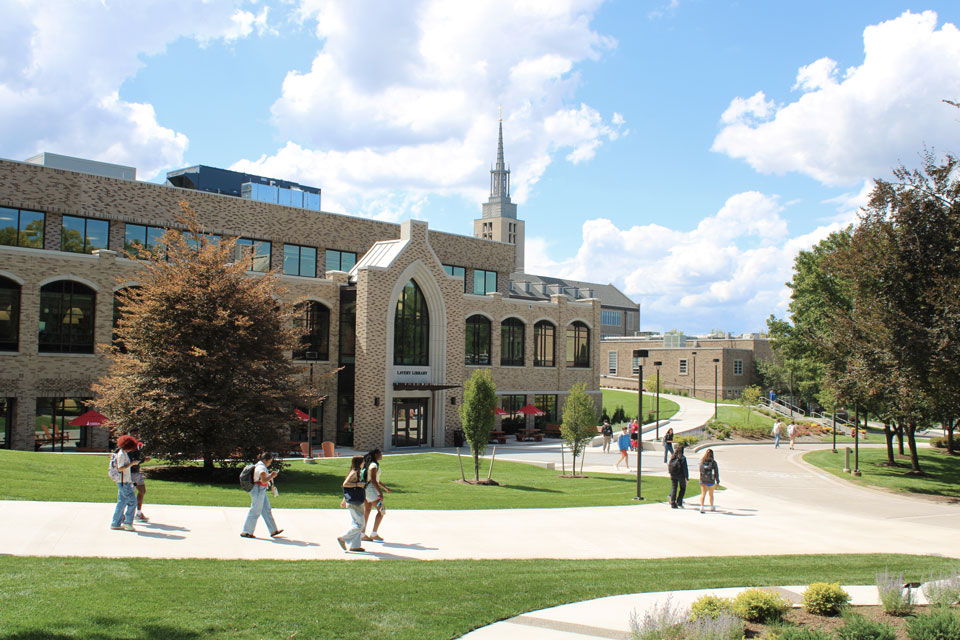 Students walk around LeChase Commons on the first day of class.
