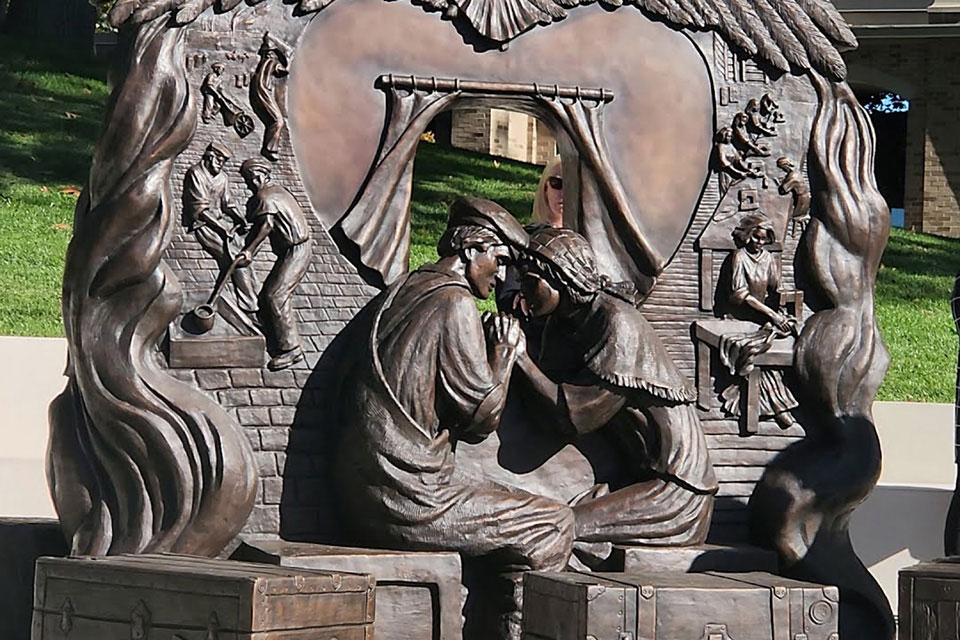 Titled, “Parents’ Sacrifice,” the bronze sculpture sits adjacent to the newly renovated Lavery Library in the center of the LeChase Commons, in a beautifully landscaped spot that looks as though it has always been on campus.