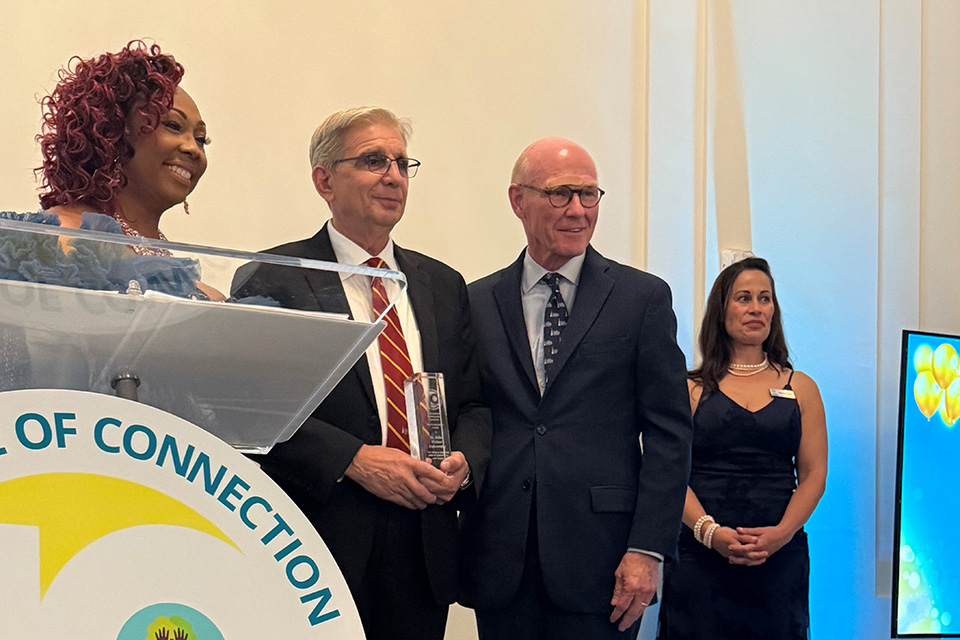 Fisher receives the Connected Communities award.