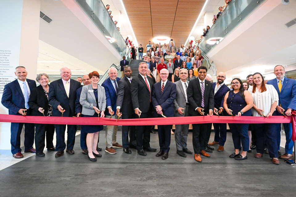 University leaders and local, state, and federal elected officials cut the ribbon at the Lavery Library Grand Reopening Celebration.