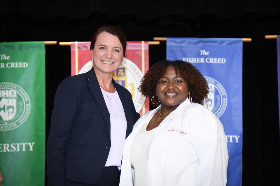 Dean Christine Birnie with a first-year pharmacy student.