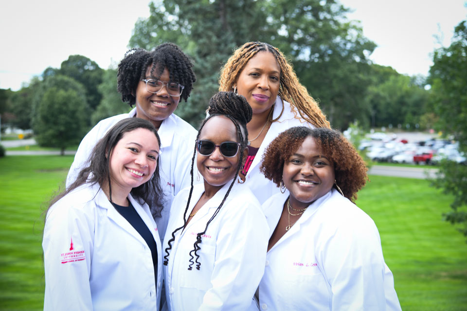 First-year students pose in their white coats.