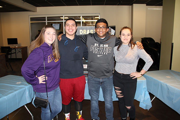 Sanjeev Sekharan (second from the right) with three members of Drastic Measures, Fisher's a cappella group.