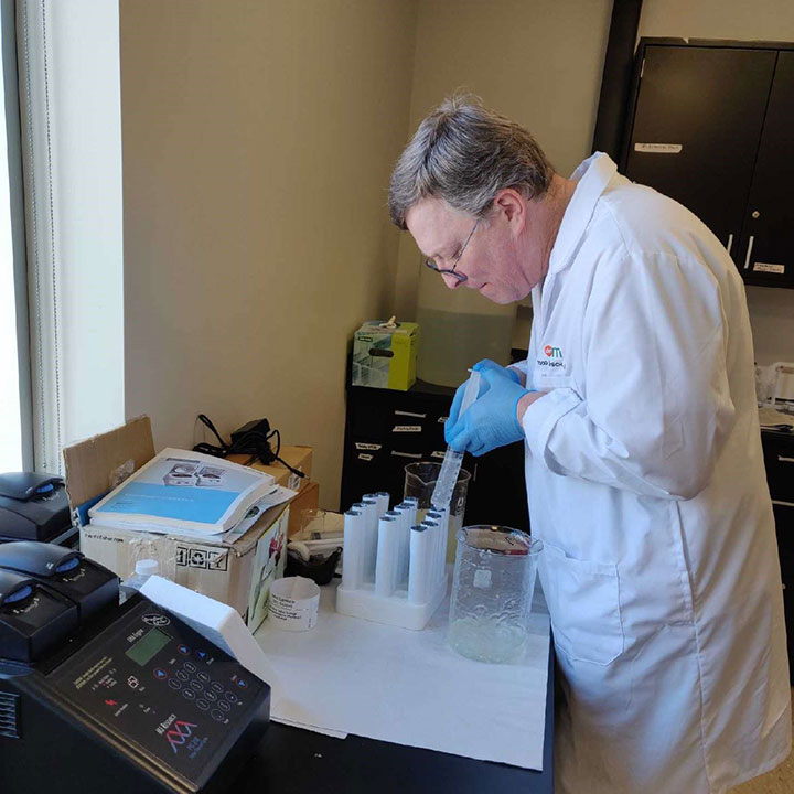 Todd Camenisch makes hand sanitizer for community partners.