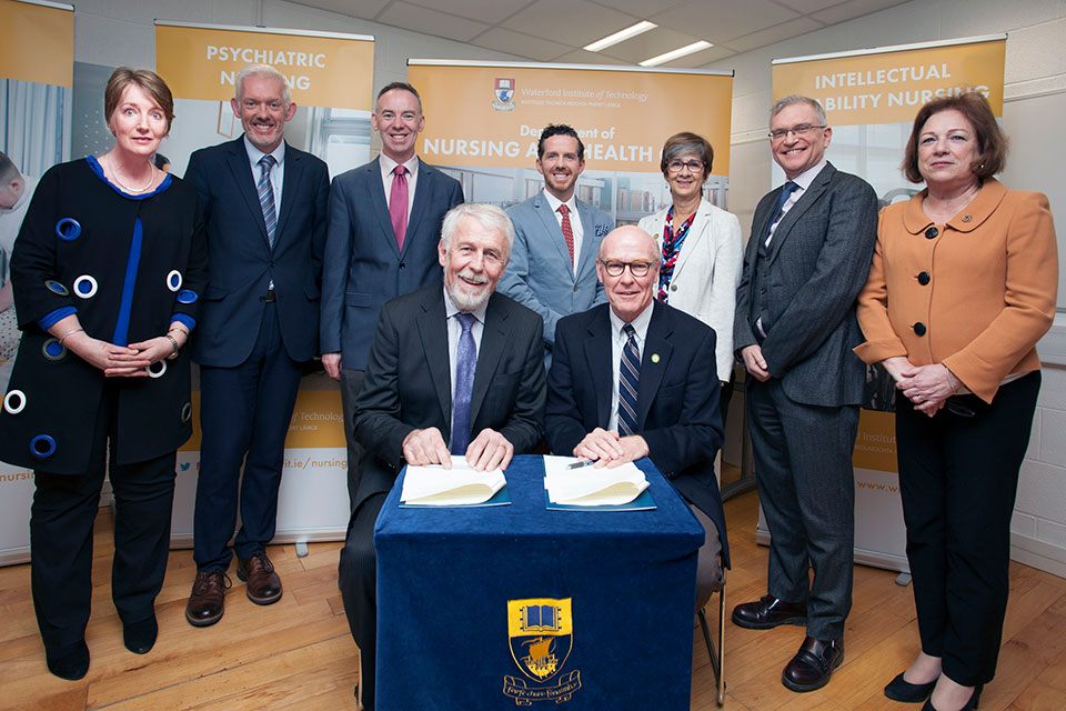 Back row: Dr. Sara Kennedy, WIT; Dr Richard Hayes, WIT; Dr. Michael Harrison, WIT; Professor John Nolan, WIT; Ann Costello, Golisano Foundation; Professor John Wells, WIT; Dr. Dianne Cooney Miner, Wegmans School of Nursing. Seated: Jim Moore, WIT; President Gerard Rooney, St. John Fisher College.