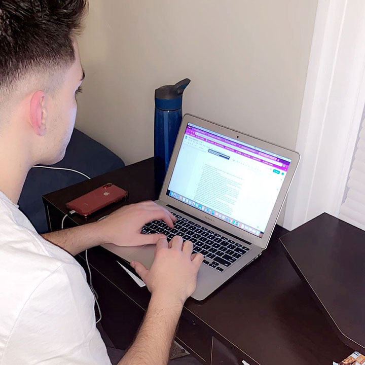 Jacob Thompson works on tasks for his marketing and communications internship in the Advancement Department at Bishop Kearney High School. 