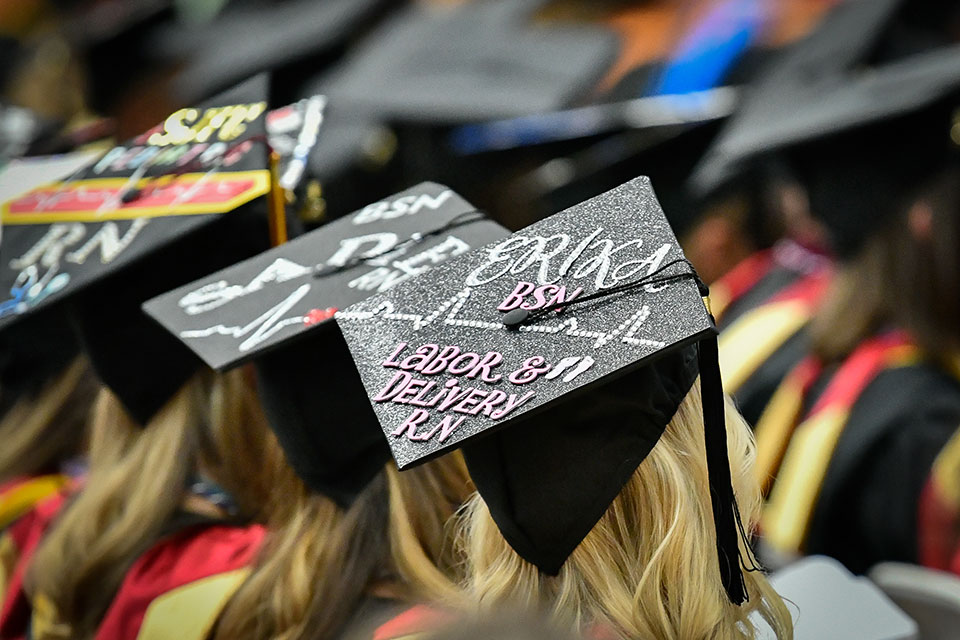 A nursing graduate's mortar board celebrates entering the nursing profession.