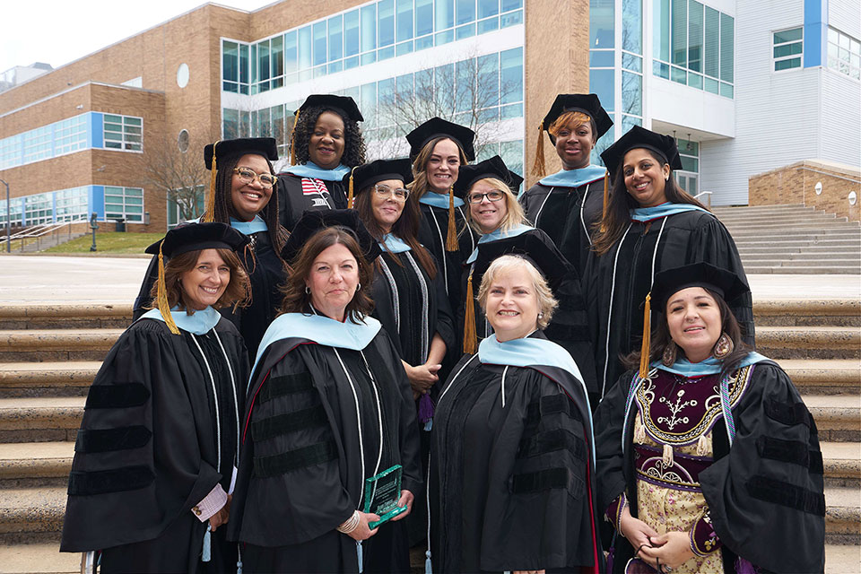 Graduates of the Ed.D. in Executive Leadership program at the extension site at Onondaga Community College.