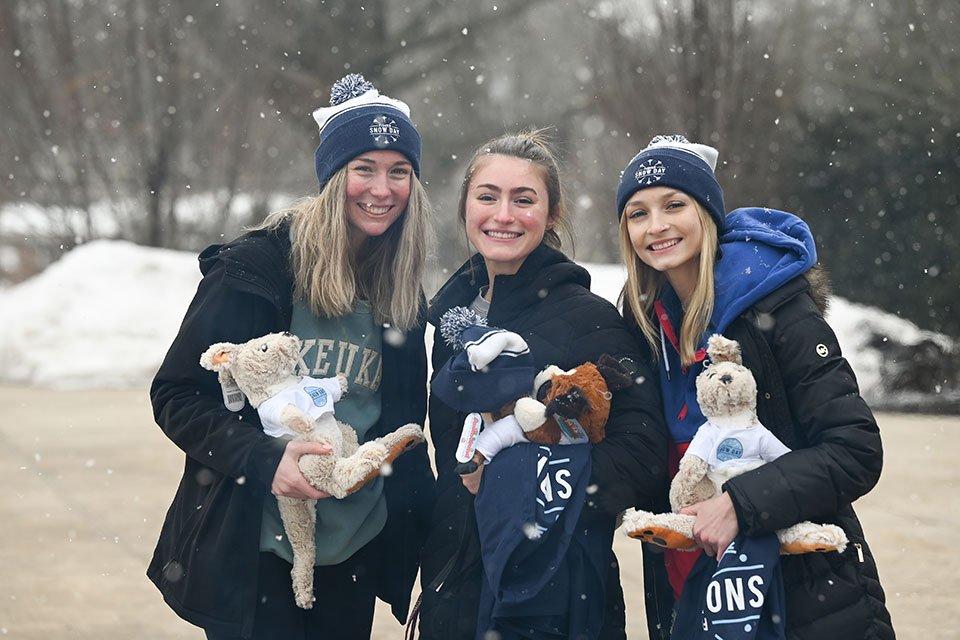 Three students at the 2022 Fisher Snow Day!