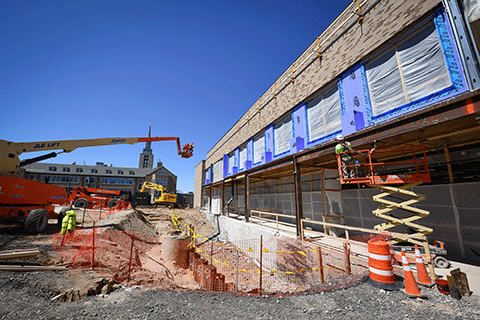 Crews work on the exterior of Lavery Library.