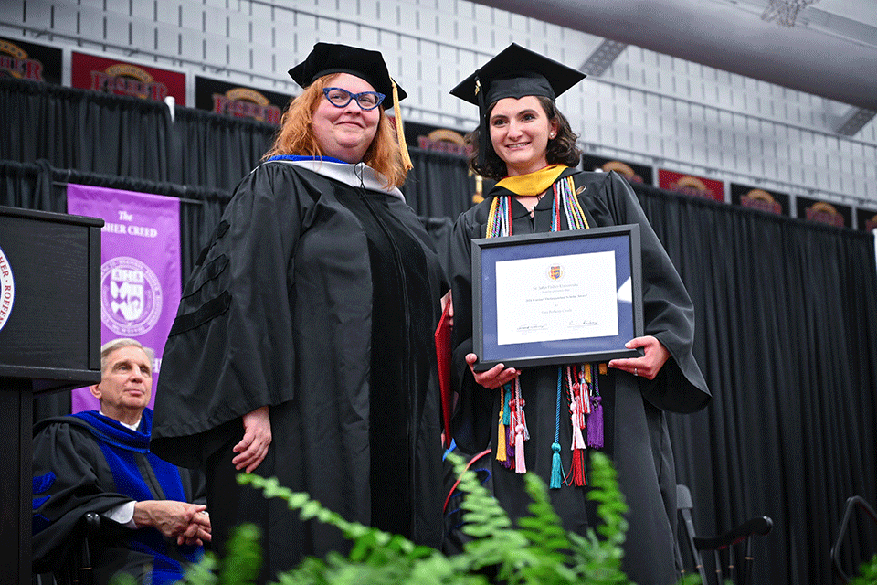 Dean Joellen Maples congratulates Sara Casale on earning a Trustee Distinguished Scholar Award.