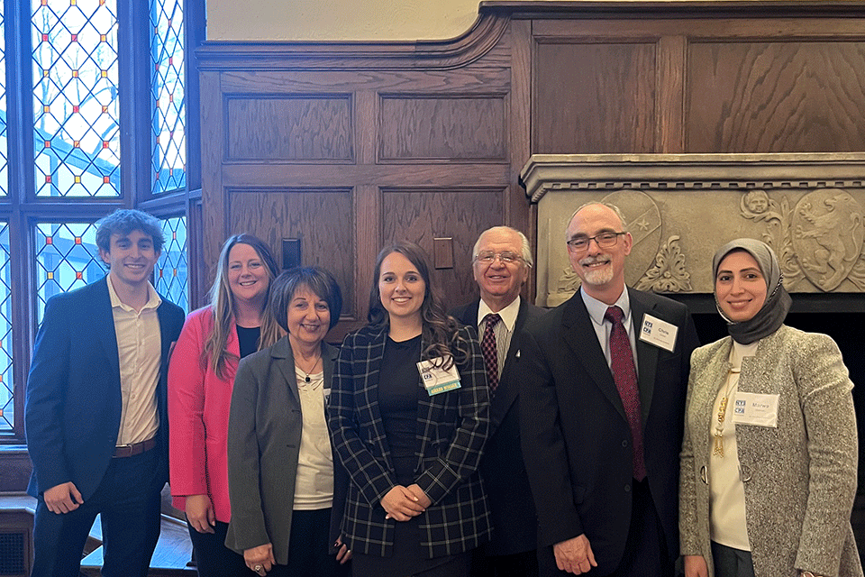 Honoree Adrianna Carfagna with her parents and members of the School of Business community.