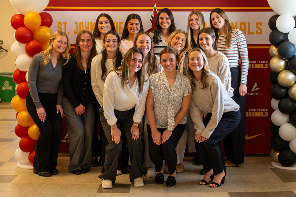 A group of student-athletes celebrate their induction into the athletics national honor society.