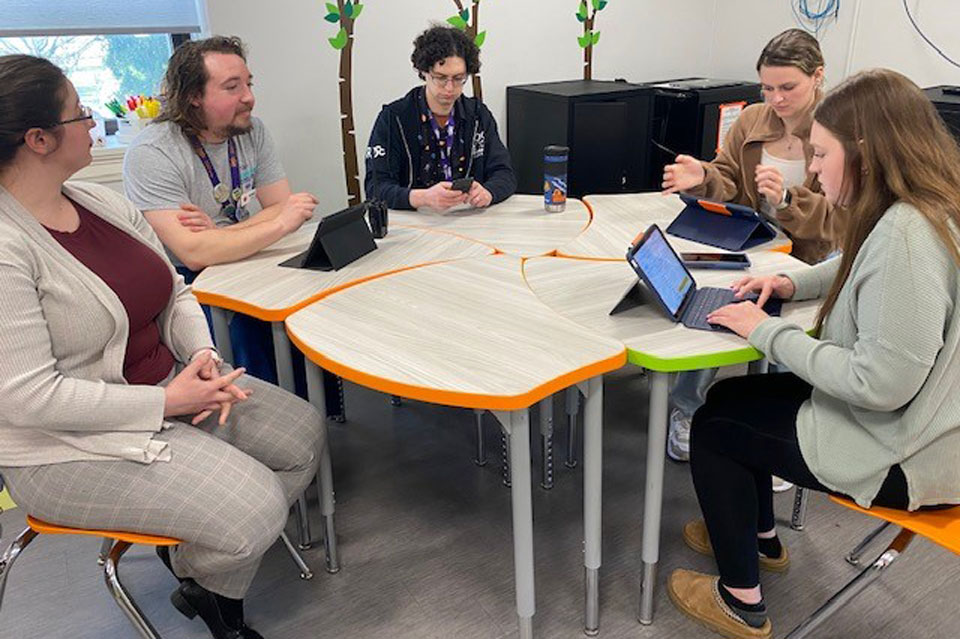 Fisher students Alyssa and Julia present to staff at RMSC.