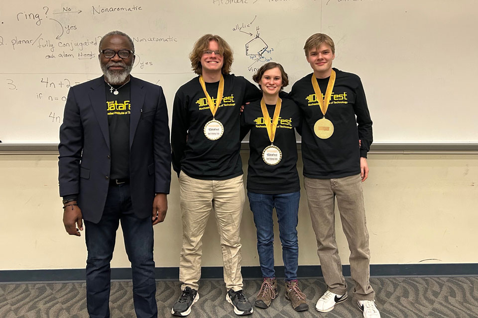 The winners of DataFest with the event organizer.