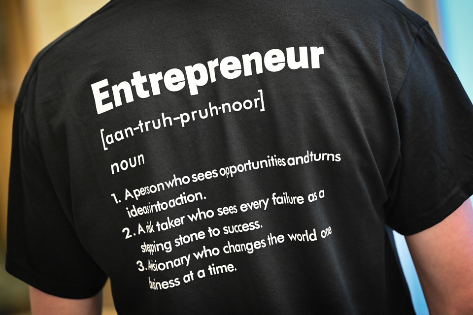 A t-shirt displays the definition of entrepreneur.