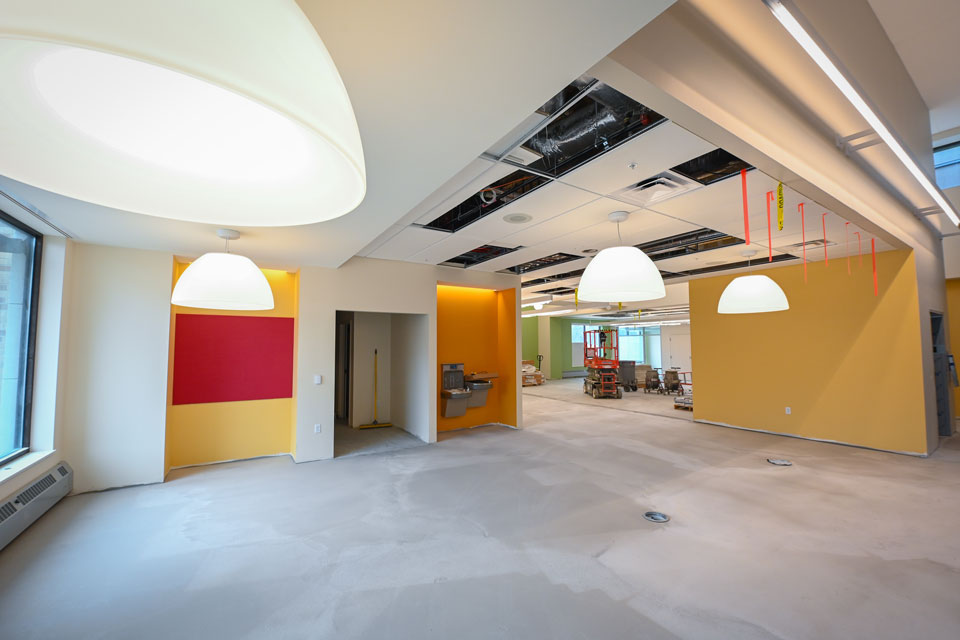 Cheery paint colors and bright lights create a welcoming yet cozy interior in Lavery Library.