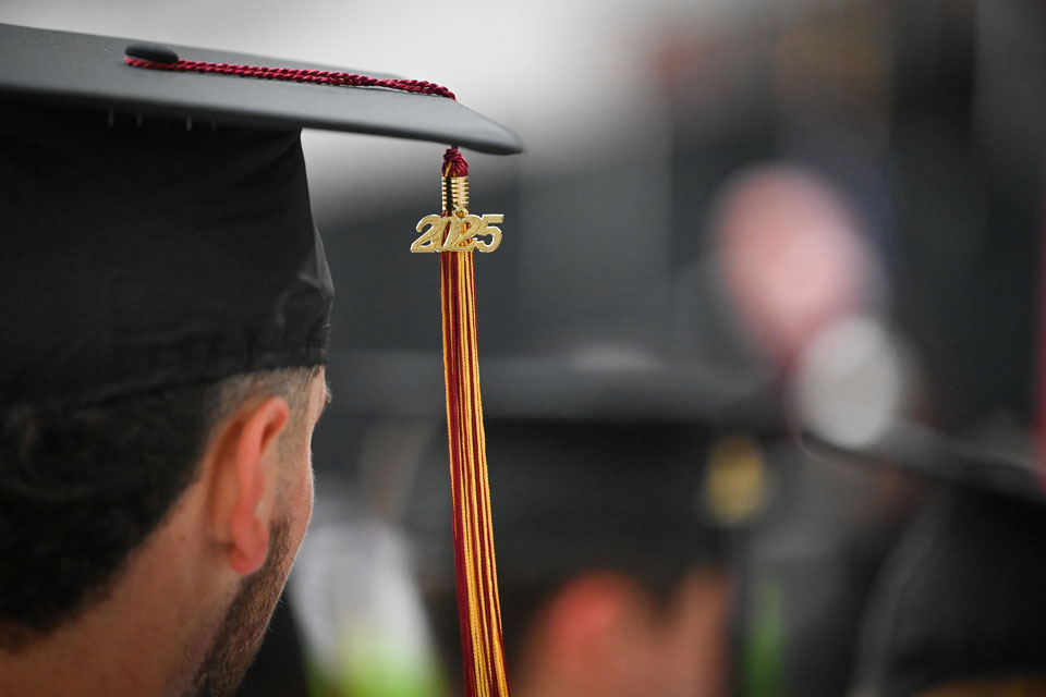 A student wears a cap with a 2025 tassel.