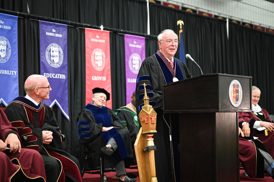 Dr. Bain accepts his president's medal.
