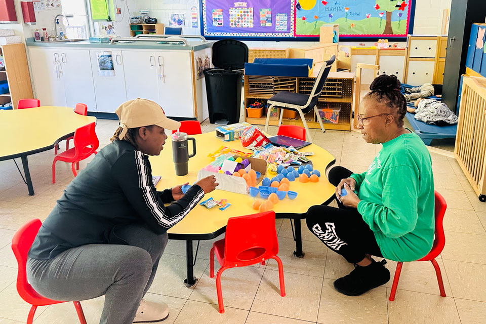 A pharmacy student works with a member of a nonprofit agency during Service Day.