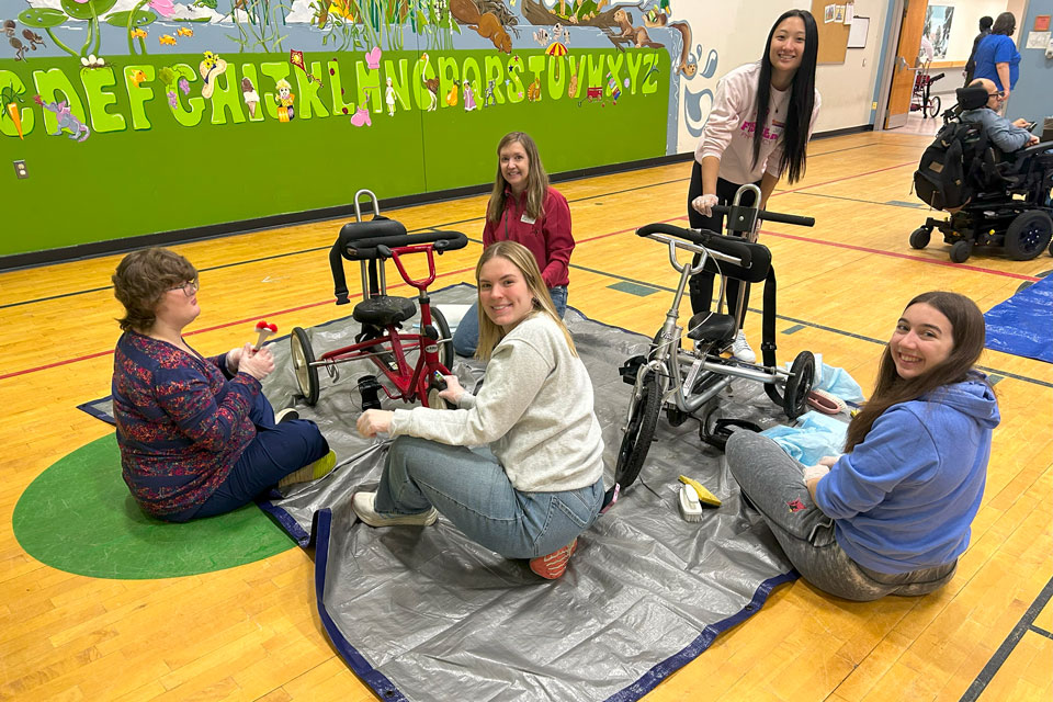 Pharmacy students clean wheelchairs at CP Rochester.
