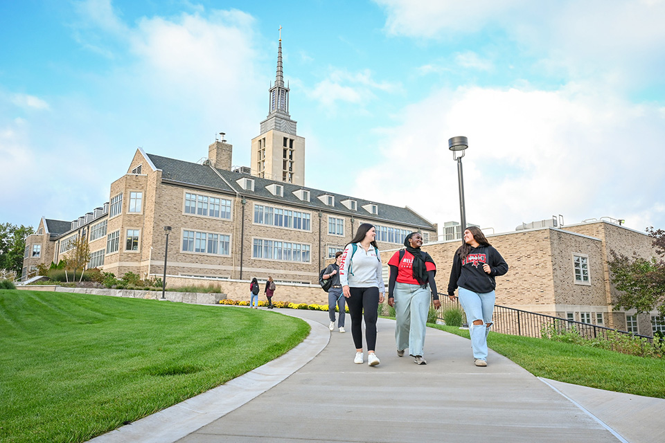 Students walking on campus near Kearney Hall