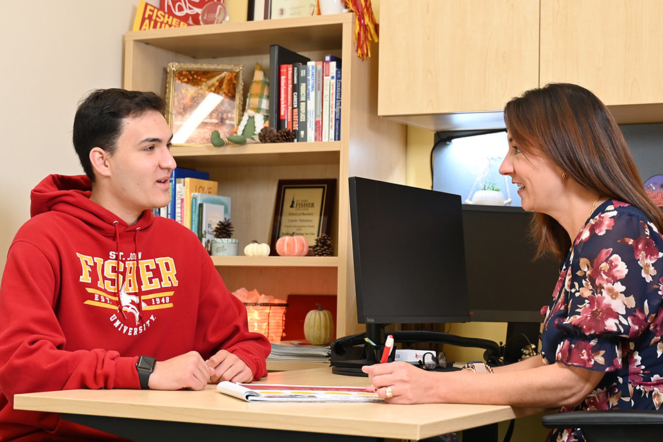 A student meets with a member of the career services team.