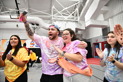 A male and female student at the Teddi Dance singing